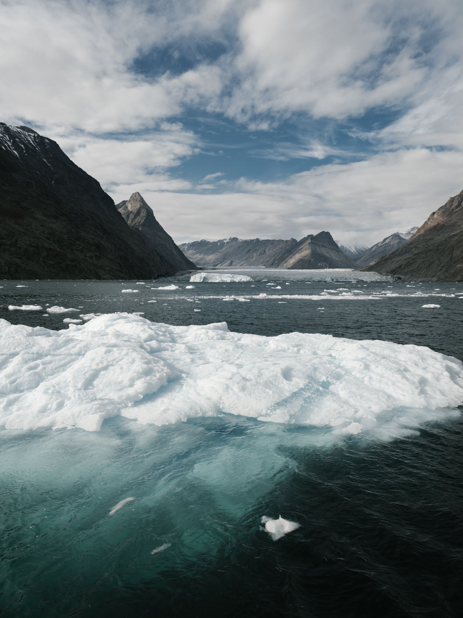 Towering ice formations over dark water — the rugged Newfoundland coastline that inspired Netflix's Below