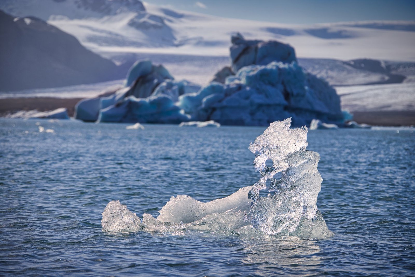 Icebergs floating in a dark glacial lagoon — Below Netflix true story explainer