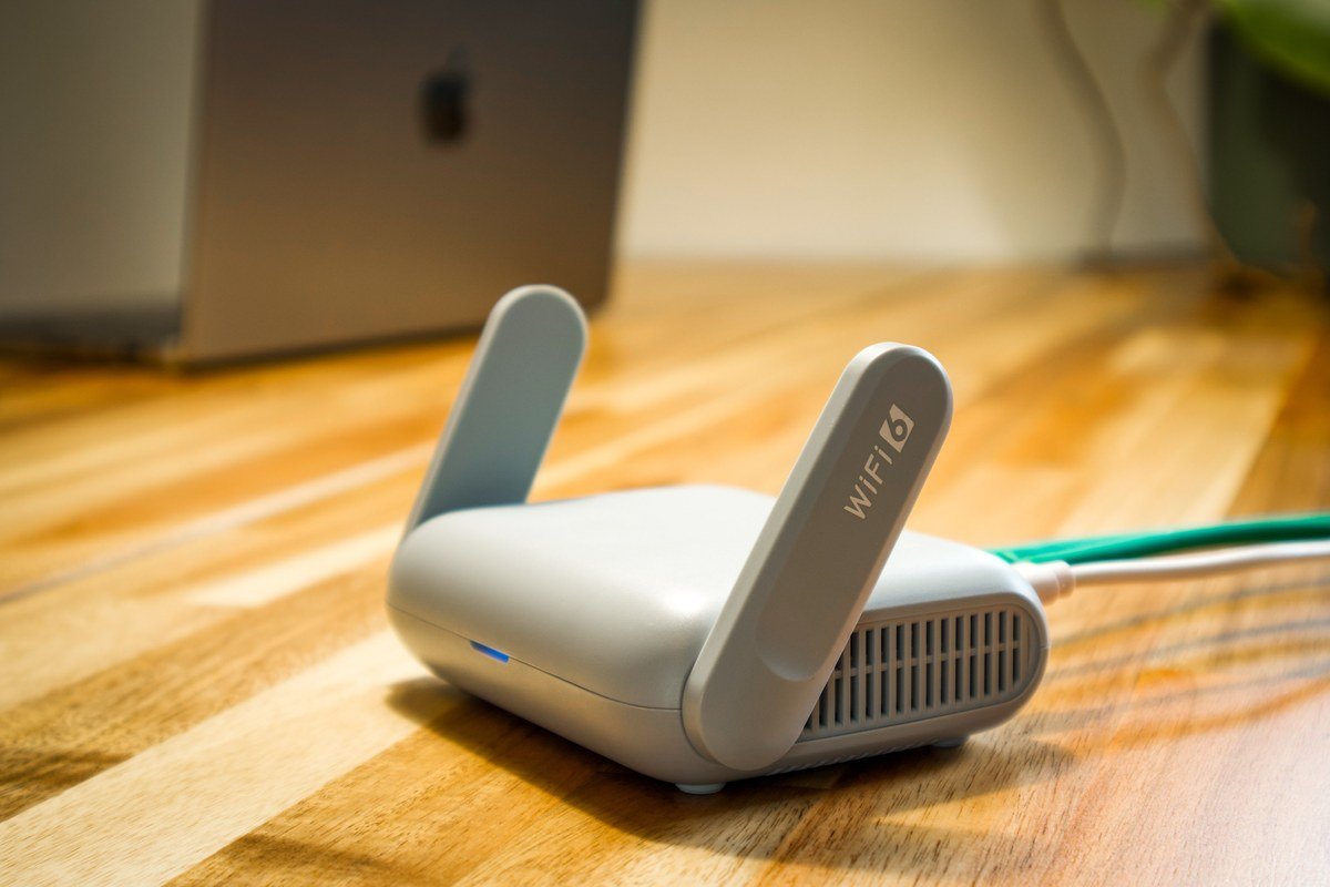 WiFi router placed high and central in a living room with strong signal waves spreading outward